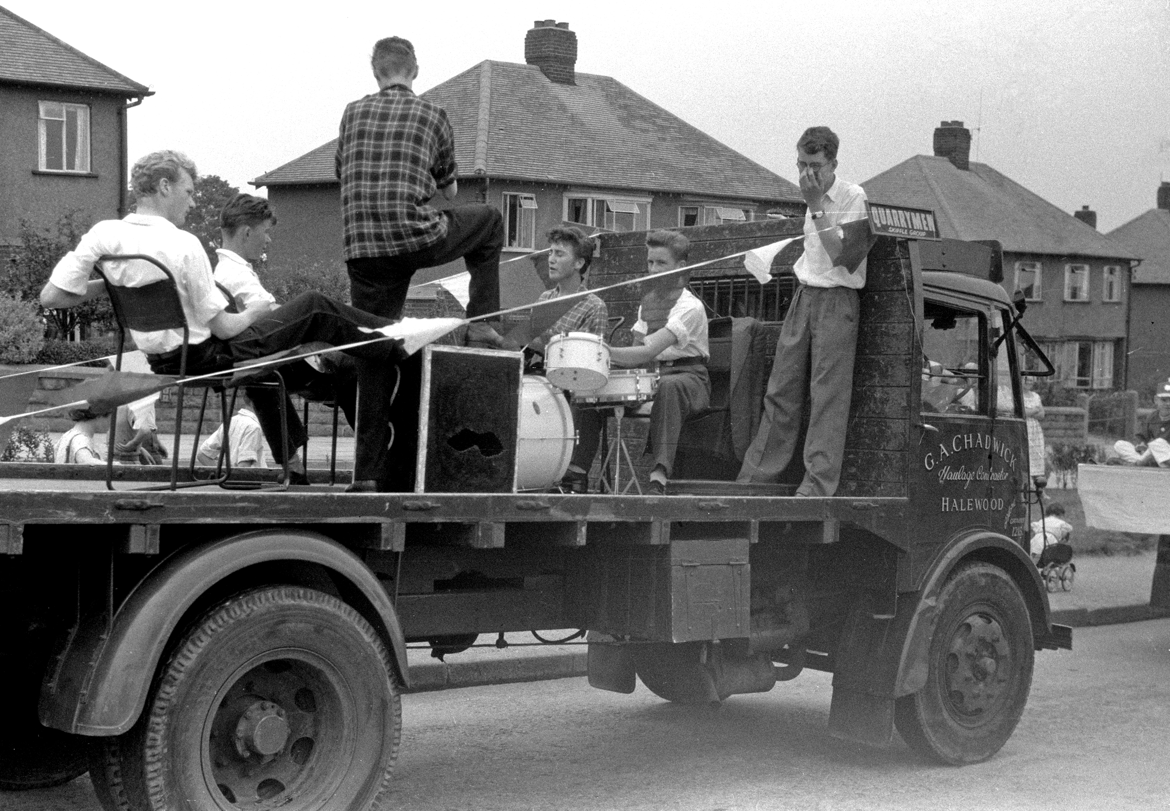 m Truck L to R Pete Shotton, Eric Griffiths, Len Garry, John Lennon, Colin Hanton, Rod Davis BW